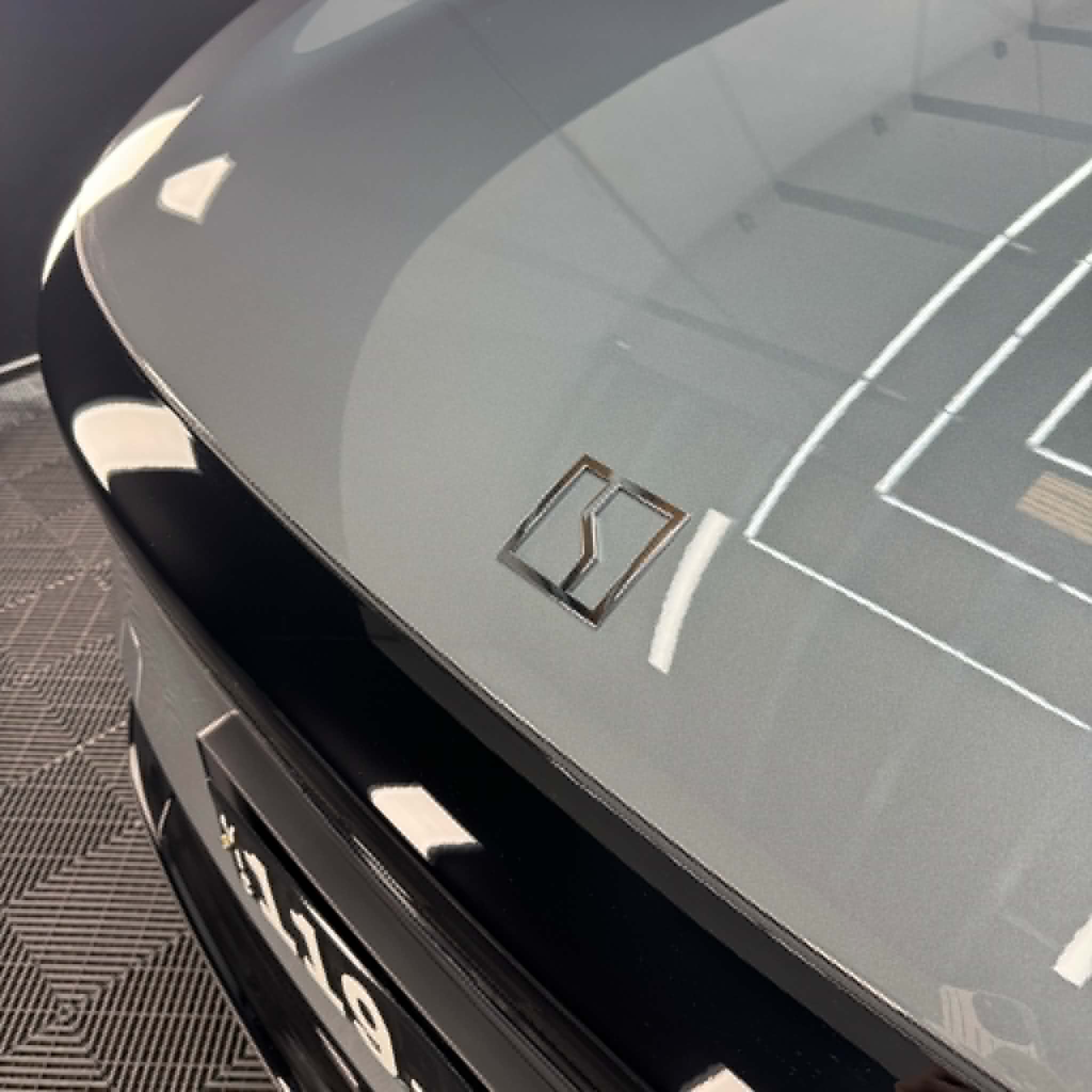 Gloss dark green — rear badge detail